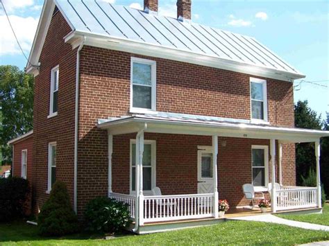 red brick house with silver metal roof|metal roofs on brick houses.